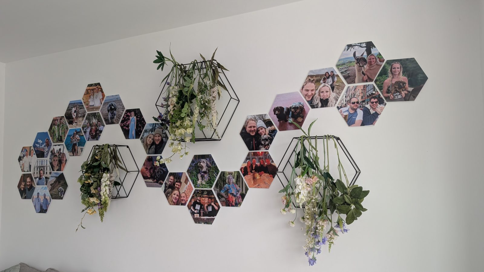 A wall of hexagonal magnetic Facet photo tiles